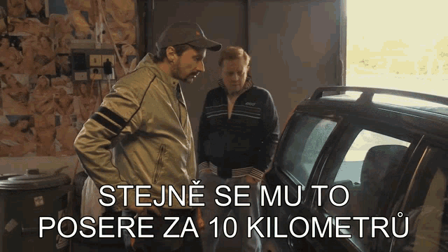 a man and a woman are standing in front of a car with the words stoje se mu to posere za 10 kilometru