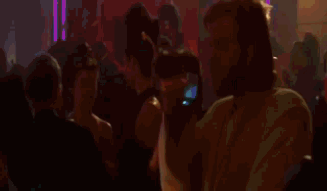 a blurred image of a person 's shoulder with a light shining on it