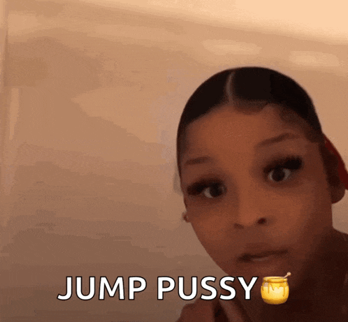a girl is holding a jar of honey in her mouth and says jump pussy .