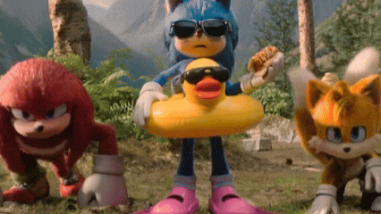 sonic the hedgehog is wearing sunglasses and holding a rubber duck in his hand .
