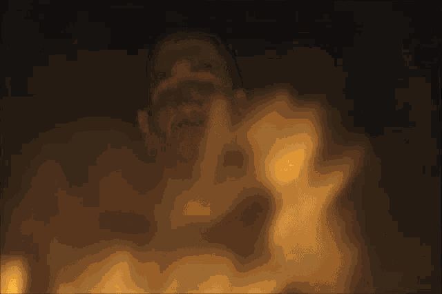 a close up of a fire burning in a fireplace with smoke coming out of it