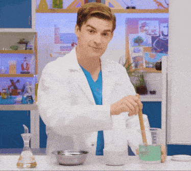a man in a lab coat is mixing a liquid in a mortar and pestle