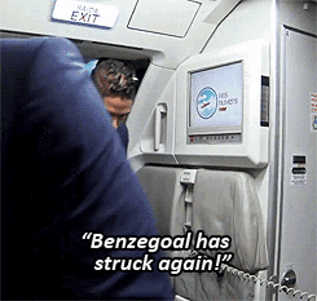 a screen on a plane says benzegoal has struck again on it