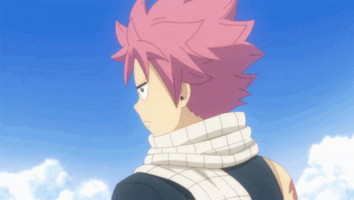 a boy with pink hair and a scarf around his neck