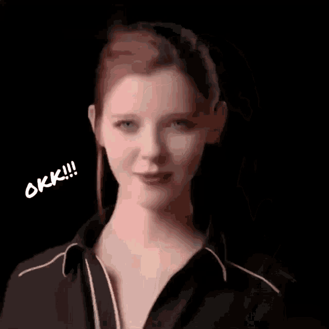 a woman is smiling and giving a thumbs up with the words okk !!! above her