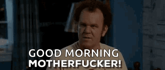 a man is saying `` good morning motherfucker '' while sitting in a room .