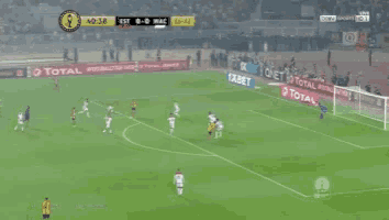 a soccer game is being played with ads for 1xbet and total on the sidelines