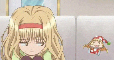 a blonde anime girl is sitting on a couch with her eyes closed and a red headband .