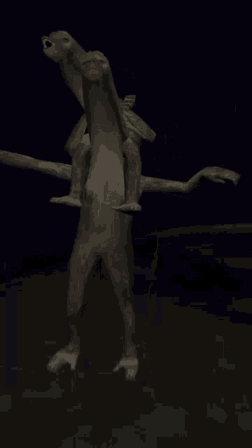 a couple of monkeys standing next to each other in a dark room