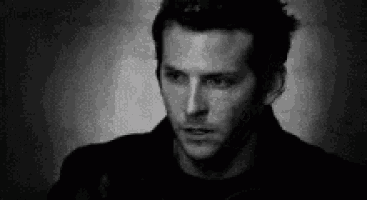 a black and white photo of a man 's face .