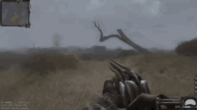 a person holding a shotgun in a video game with the number 2/70 on the bottom
