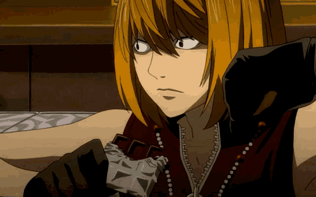 a close up of a person 's face with a necklace that says ' akira ' on it