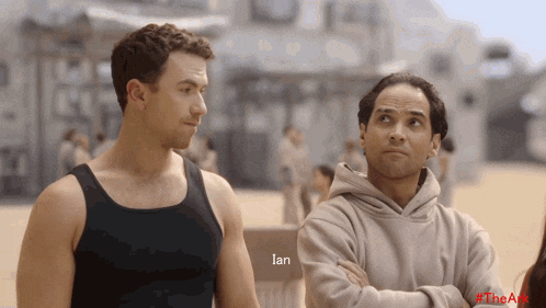 two men are standing next to each other and the word ian is visible
