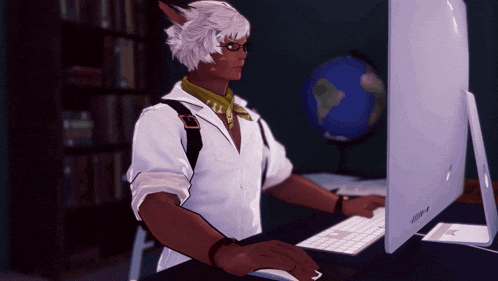 a man sitting at a desk with a computer and a keyboard