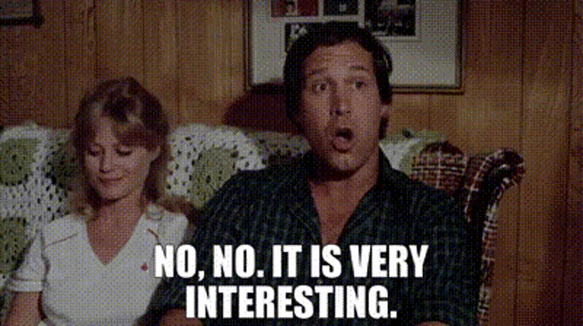 a man and a woman are sitting on a couch and the man is saying no , no , it is very interesting