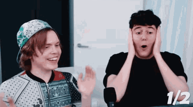 a man covering his ears with his hands while another man looks surprised with the number 1/2 on the bottom right