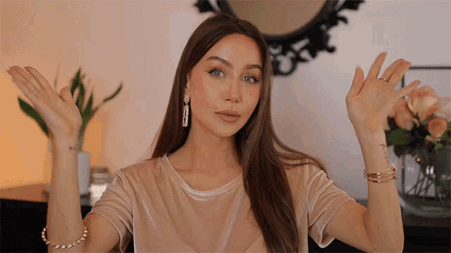 a woman with a tattoo on her wrist that says ' i am a woman '