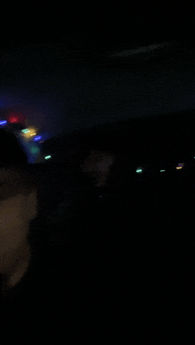 a man is screaming in the dark in a dark room