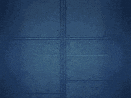 a cartoon character is standing in front of a wall in a dark room