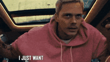 a man in a pink hoodie is saying " i just want "
