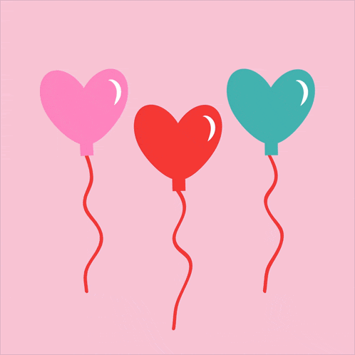 three heart shaped balloons are floating in the air