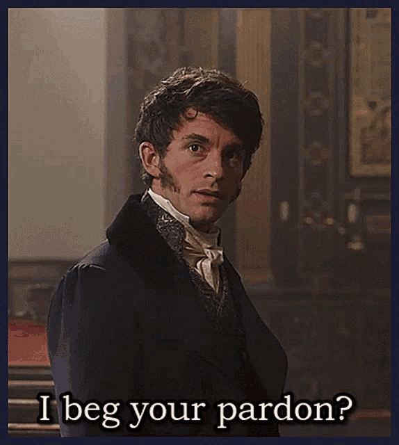 a man in a suit and tie is asking for pardon