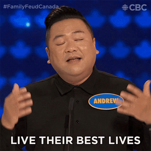 a man wearing a name tag that says andrew on it