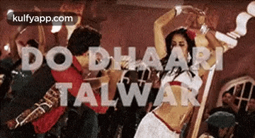 a group of people are dancing in a room with the words do dhaari talwar in the background .