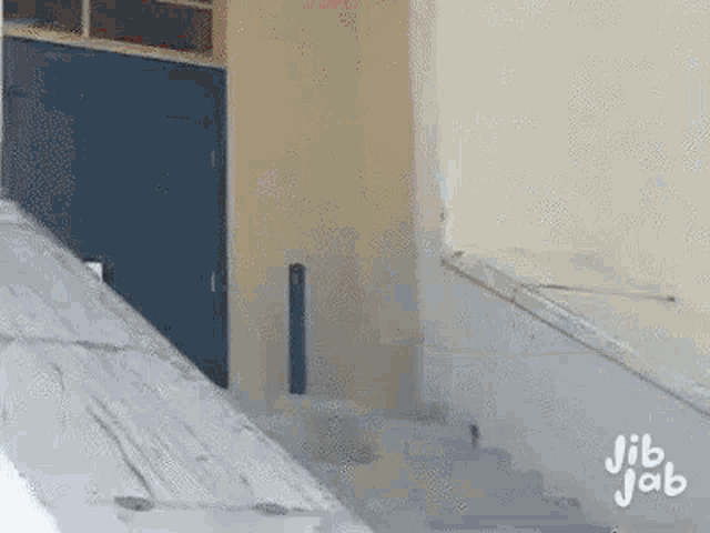 a person is walking down a set of stairs .