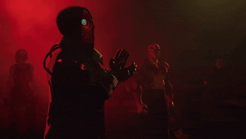 a man in a red mask holds a gun