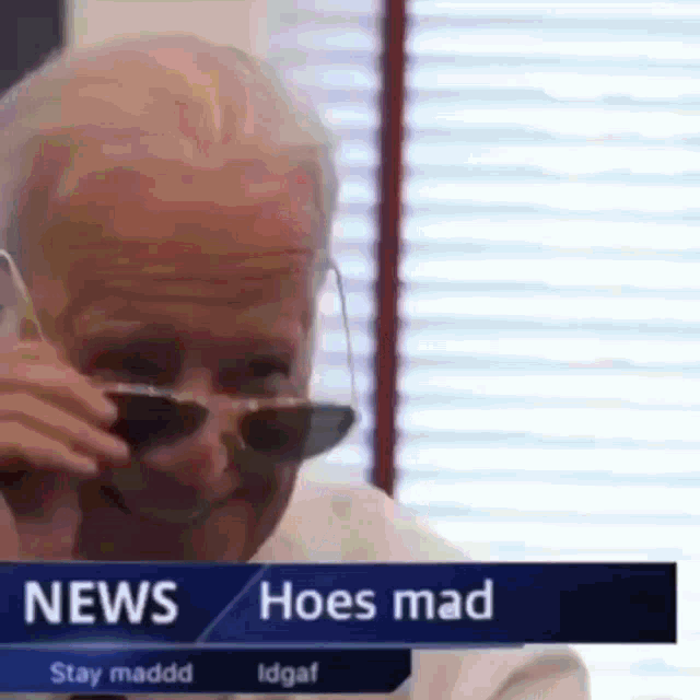 a man wearing sunglasses is on a news channel