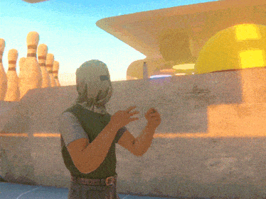 a man wearing a helmet stands in front of a wall with bowling pins
