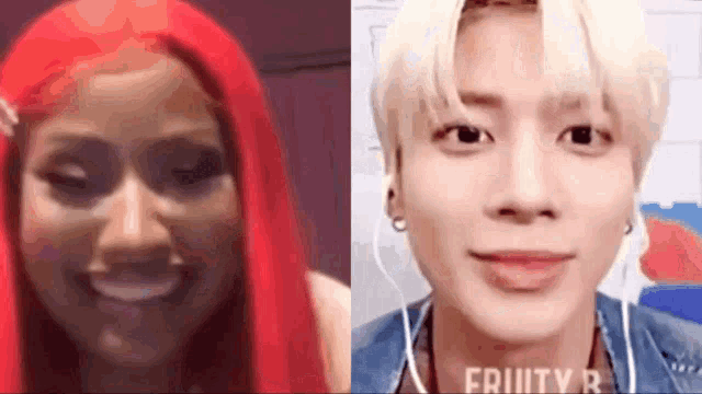 a woman with red hair is smiling next to a man with blonde hair and earphones .
