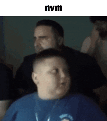 a blurry picture of a man and a boy with nvm written on the bottom