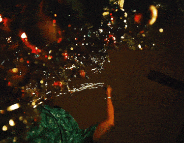 a person in a green shirt is reaching for something