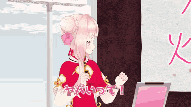 a girl in a red dress stands in front of a laptop with chinese writing on the screen