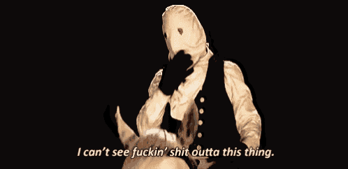 a man in a white mask is riding a dog and saying " i can 't see fuckin ' shit outta this thing