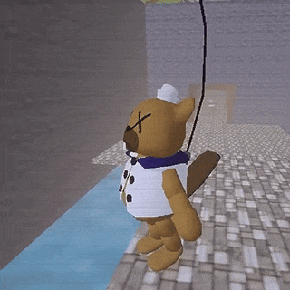 a stuffed animal is hanging upside down in a room