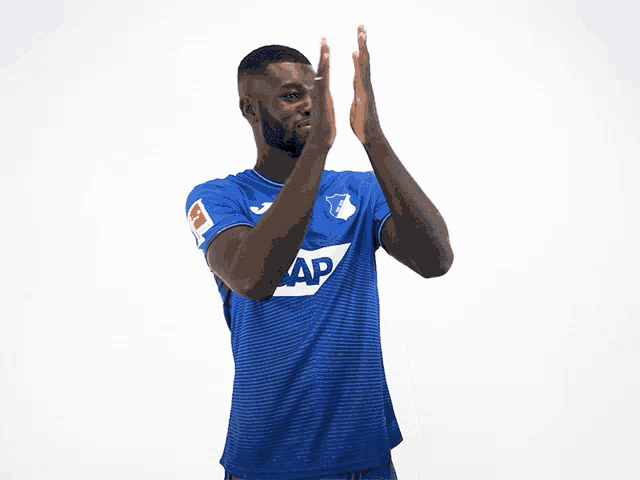 a man in a blue shirt with the word sap on the front