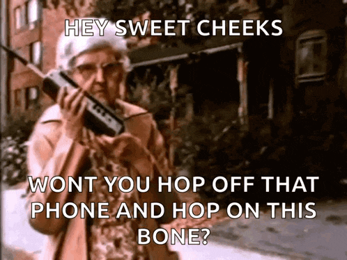 an elderly woman is holding a cell phone and says hey sweet cheeks
