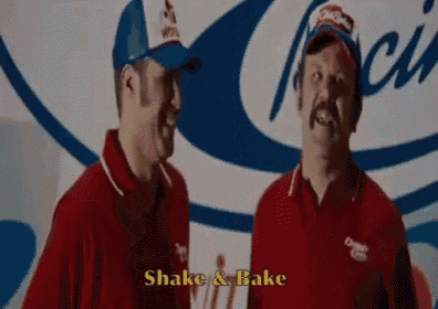 two men are standing next to each other in front of a wall that says shake and bake