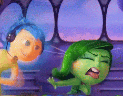 two cartoon characters , joy and disgust , are dancing together in a room .