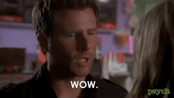 a man is talking to a woman and the word wow is on his face