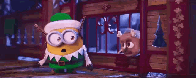 a minion wearing a santa hat is standing in front of a window