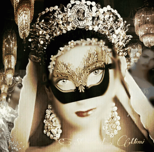 a woman wearing a mask and a tiara has the word umi on the bottom right