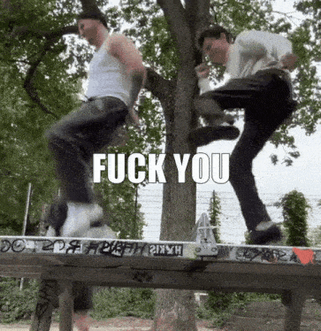 two men are doing a trick on a skateboard and the words fuck you are on the bottom