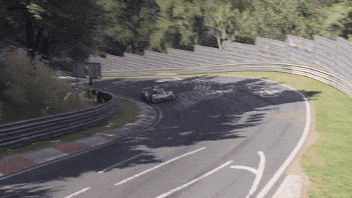 a race car is going around a curve on a race track