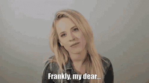 a blonde woman is making a funny face and says frankly , my dear .