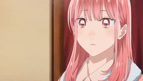 a close up of a girl with pink hair and big red eyes