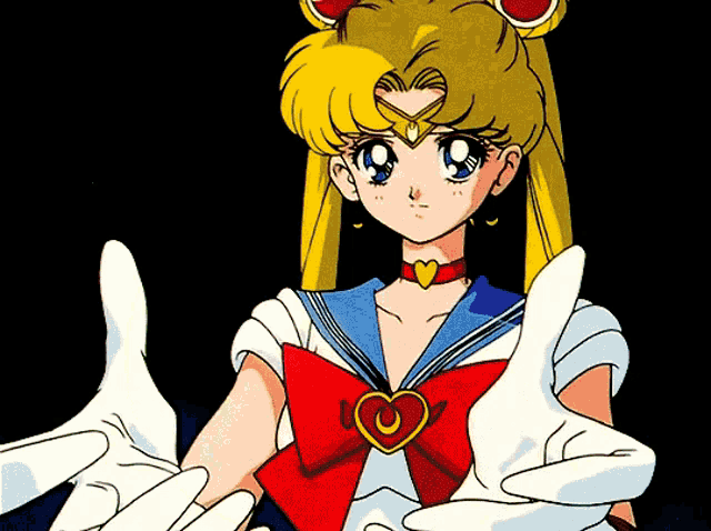 a girl in a sailor suit with a heart shaped crescent moon necklace
